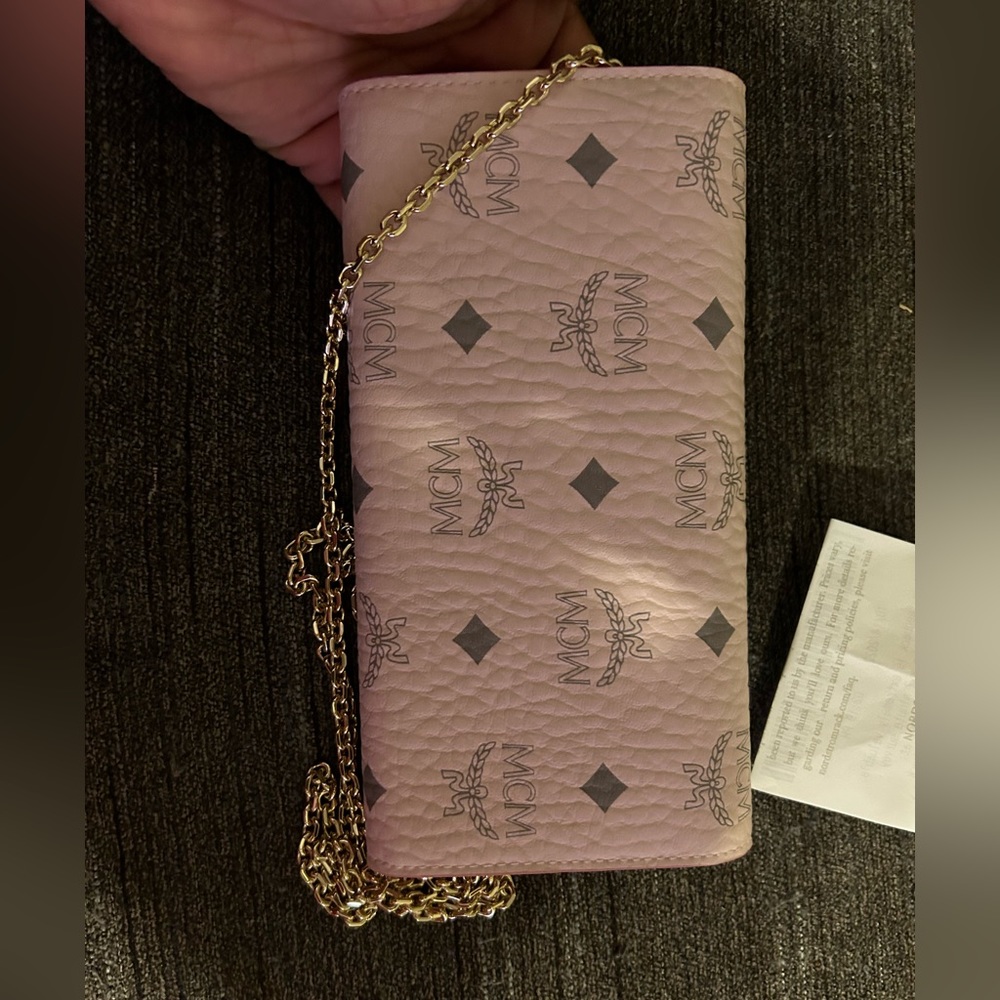 Selling a Crossbody MCM pink purse brand-new never been worn with the receipt
